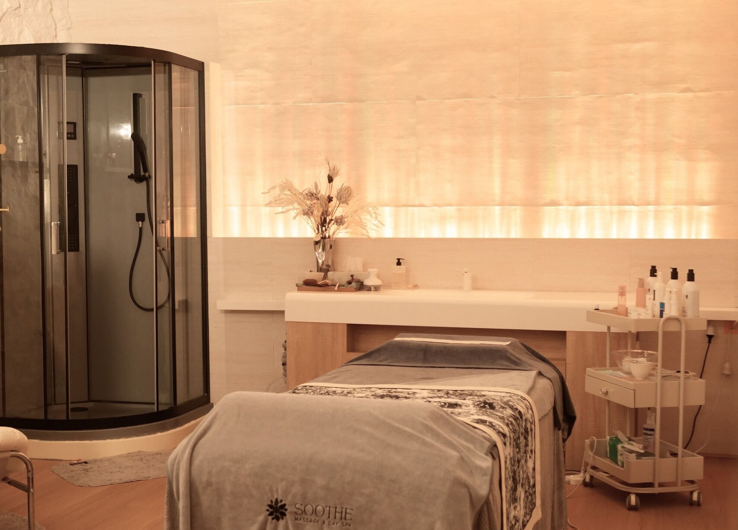 Relaxing massage room at Soothe Massage & Day Spa, Nedlands, Western Australia, AU featuring modern amenities.