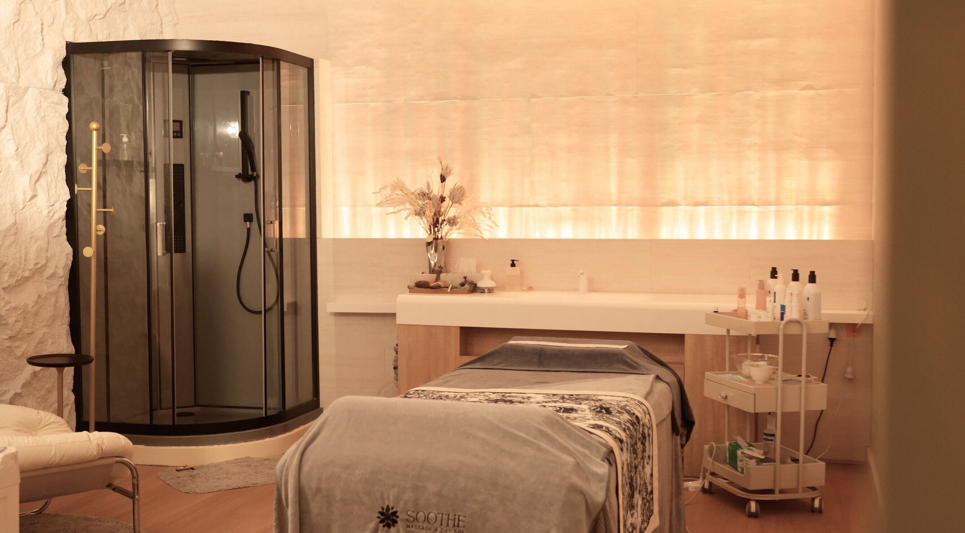 Relaxing massage room at Soothe Massage & Day Spa, Nedlands, Western Australia, AU featuring modern amenities.