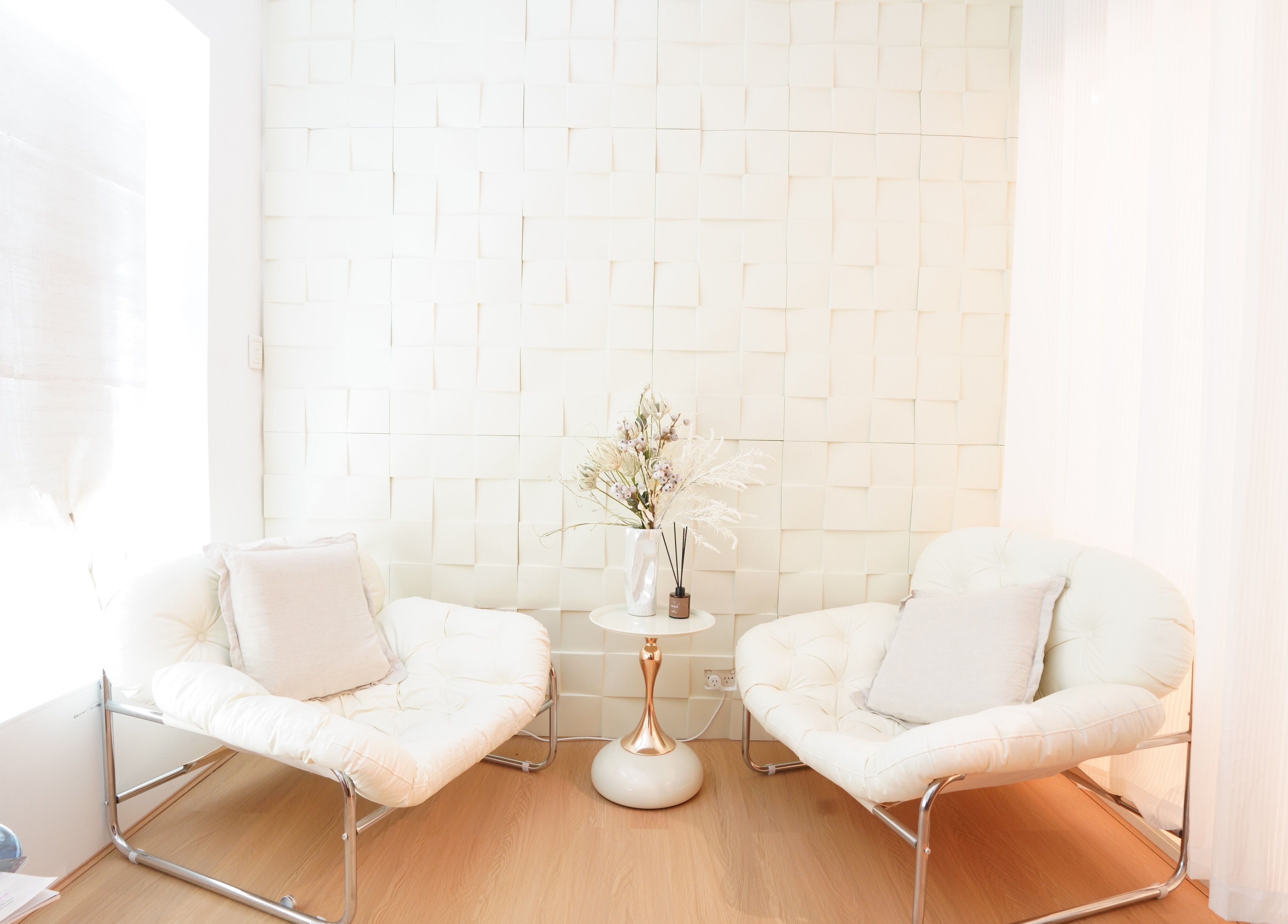 Modern lounge with plush chairs at Soothe Massage & Day Spa, Nedlands, Western Australia, AU.
