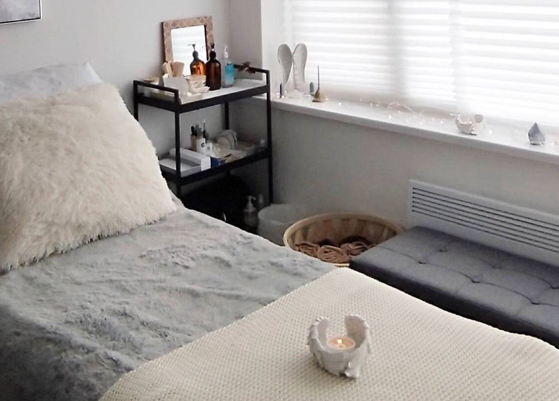 Serene therapy room at Anna Brown Intuitive Holistic Healing in Ossett, GB with plush bed and calming decor.