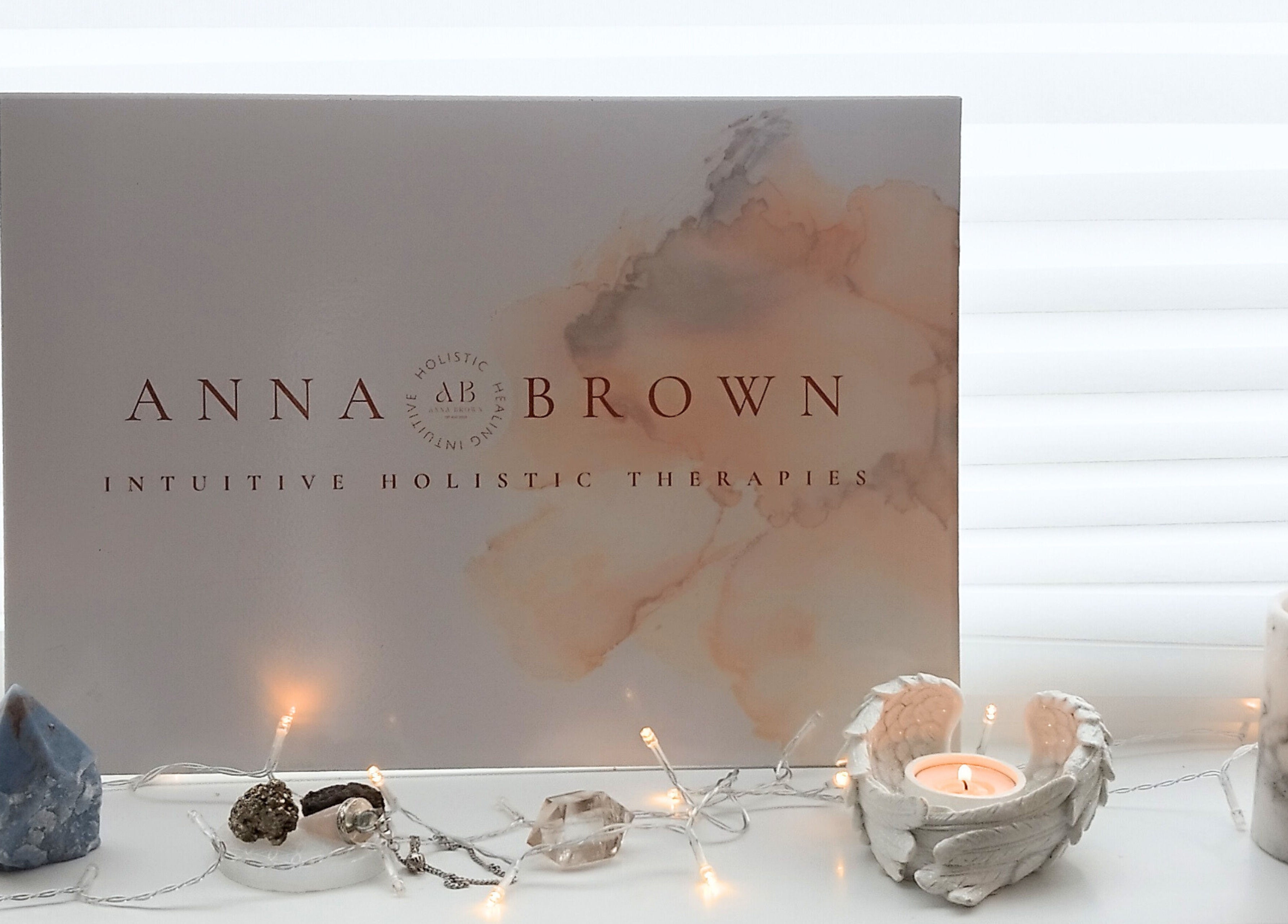 Anna Brown Intuitive Holistic Healing display with crystals and candle in Ossett, GB.