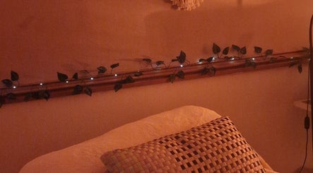 Warmly lit relaxation corner at Inner Peace Pathways, Stoke-on-Trent, England, GB with soothing decor.