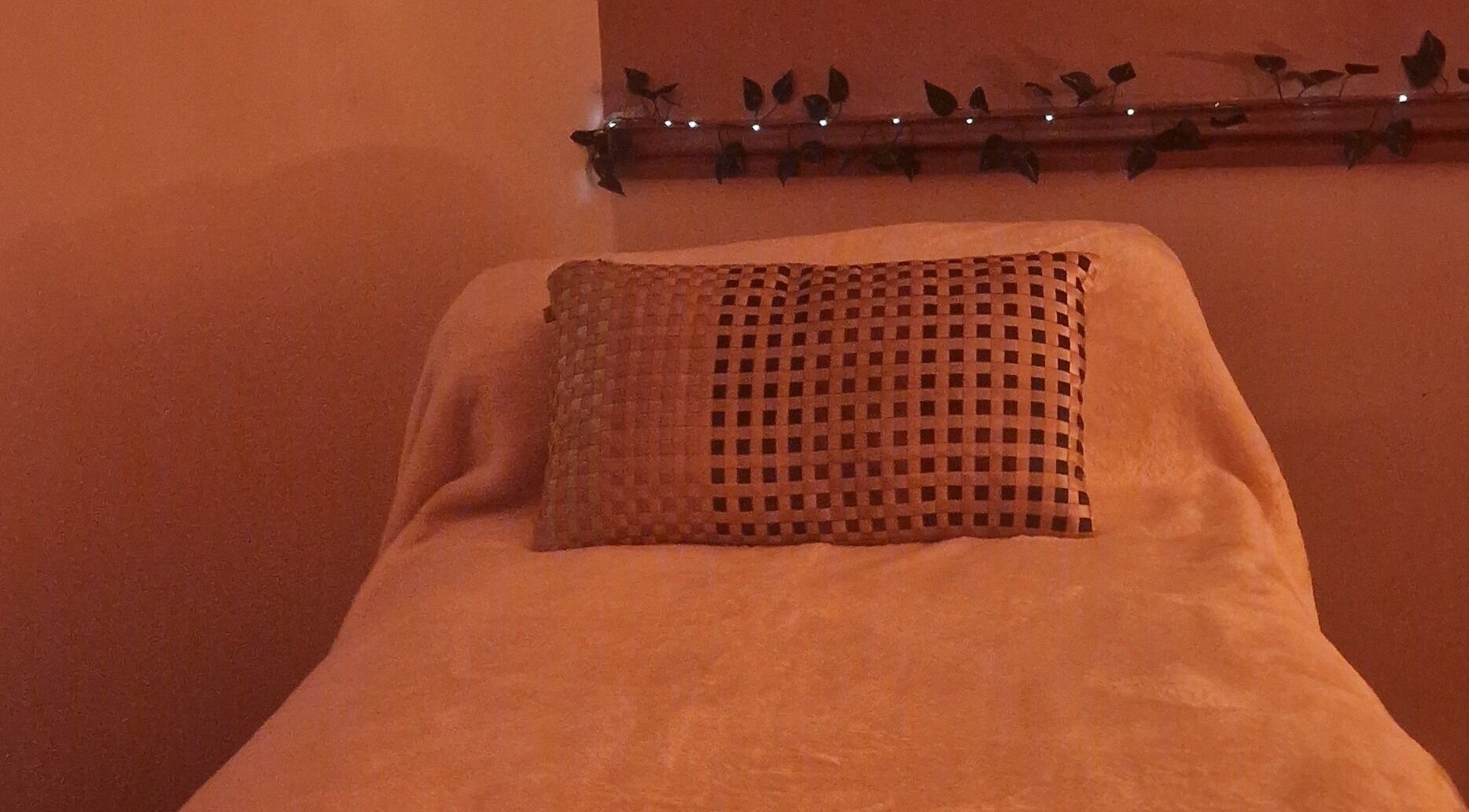 Relaxing massage bed at Inner Peace Pathways, Stoke-on-Trent, England, GB, with warm ambient lighting.