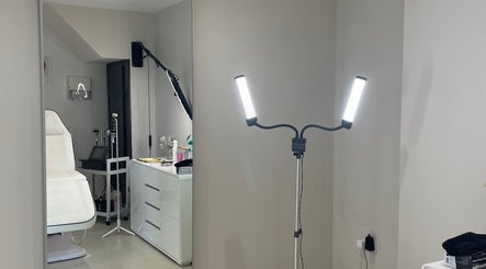 Modern treatment room at Aesthetics By Anna, Southport, England, GB, featuring bright lighting and a sleek design.