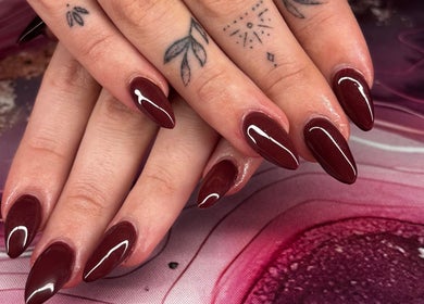 Beautiful burgundy nail art by Borscz Beauty in Gowrie, Australian Capital Territory, AU on a delicate hand.