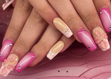 Stylish pink and nude nail art with floral accents at Borscz Beauty in Gowrie, Australian Capital Territory, AU.