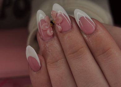 Elegant French manicure with floral design at Borscz Beauty, Gowrie, Australian Capital Territory, AU.