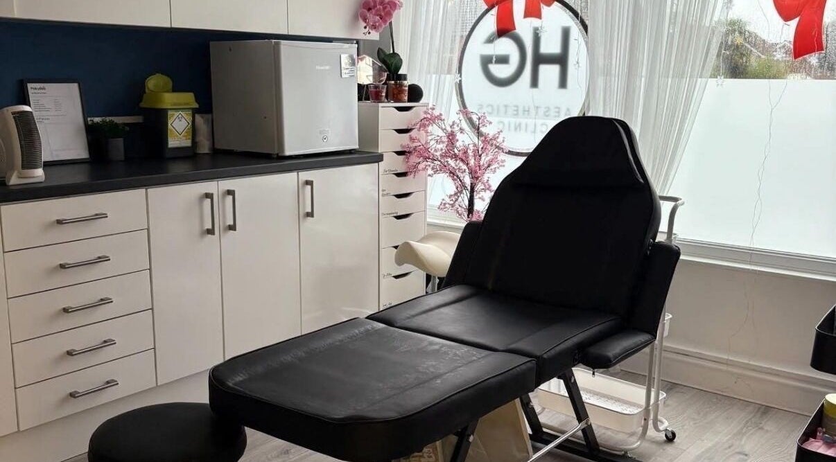 Modern treatment room with black chair at B.A Aesthetics, Lyneham, England, GB, offering a serene wellness experience.