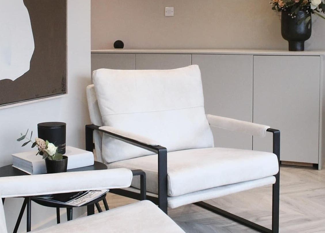 Elegant seating area at Polished Harrogate, Harrogate, England, GB, boasting modern decor and cozy armchairs.