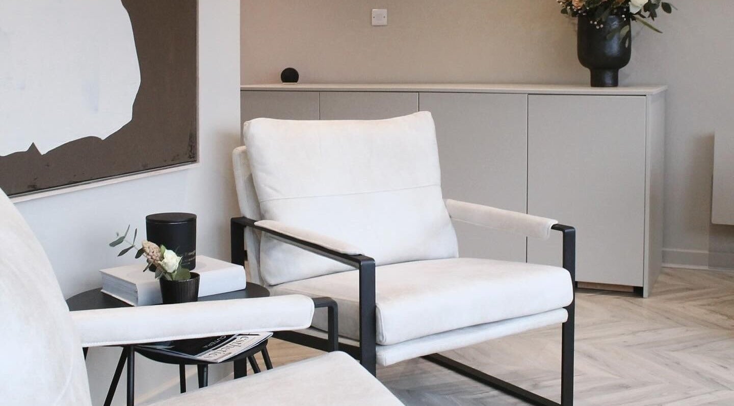 Elegant seating area at Polished Harrogate, Harrogate, England, GB, boasting modern decor and cozy armchairs.