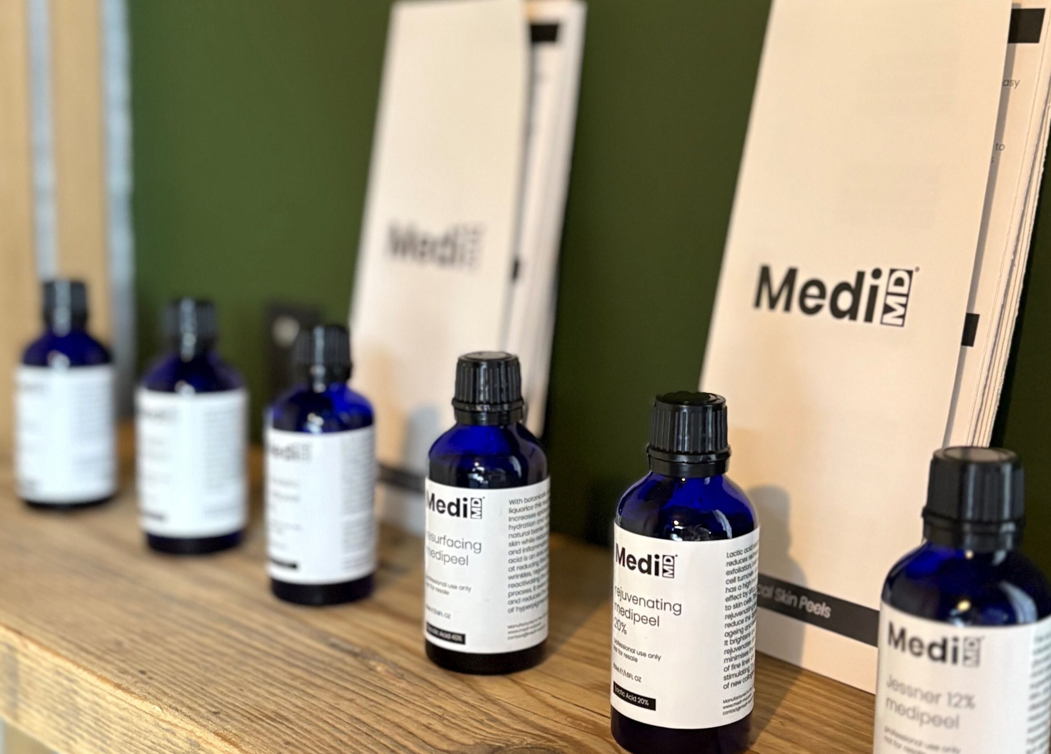 Glow and Renew Skincare in Ash, England displays MediiMD products on a wooden shelf enhancing beauty routines.