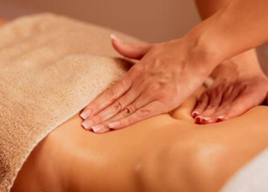 Relaxing massage at Rio Edition in London, England, GB, showcasing expert spa technique on client’s back.