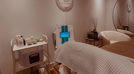 Relaxing treatment room at Rio Edition, London, England, GB featuring modern beauty equipment and cozy decor.