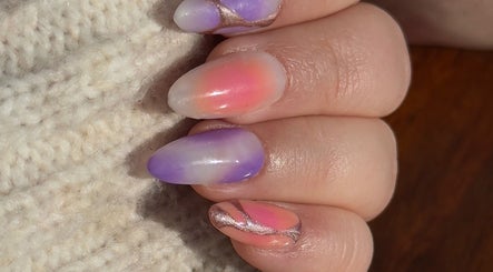 Colorful nail art with pink and purple at Cherry Aura Nails, Nottingham, England, GB.