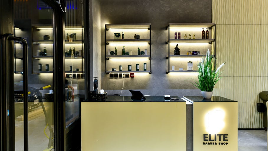 Reception area of L8 Elite Barbershop, Riyadh, Riyadh Province, SA, showcasing modern shelves and elegant design.