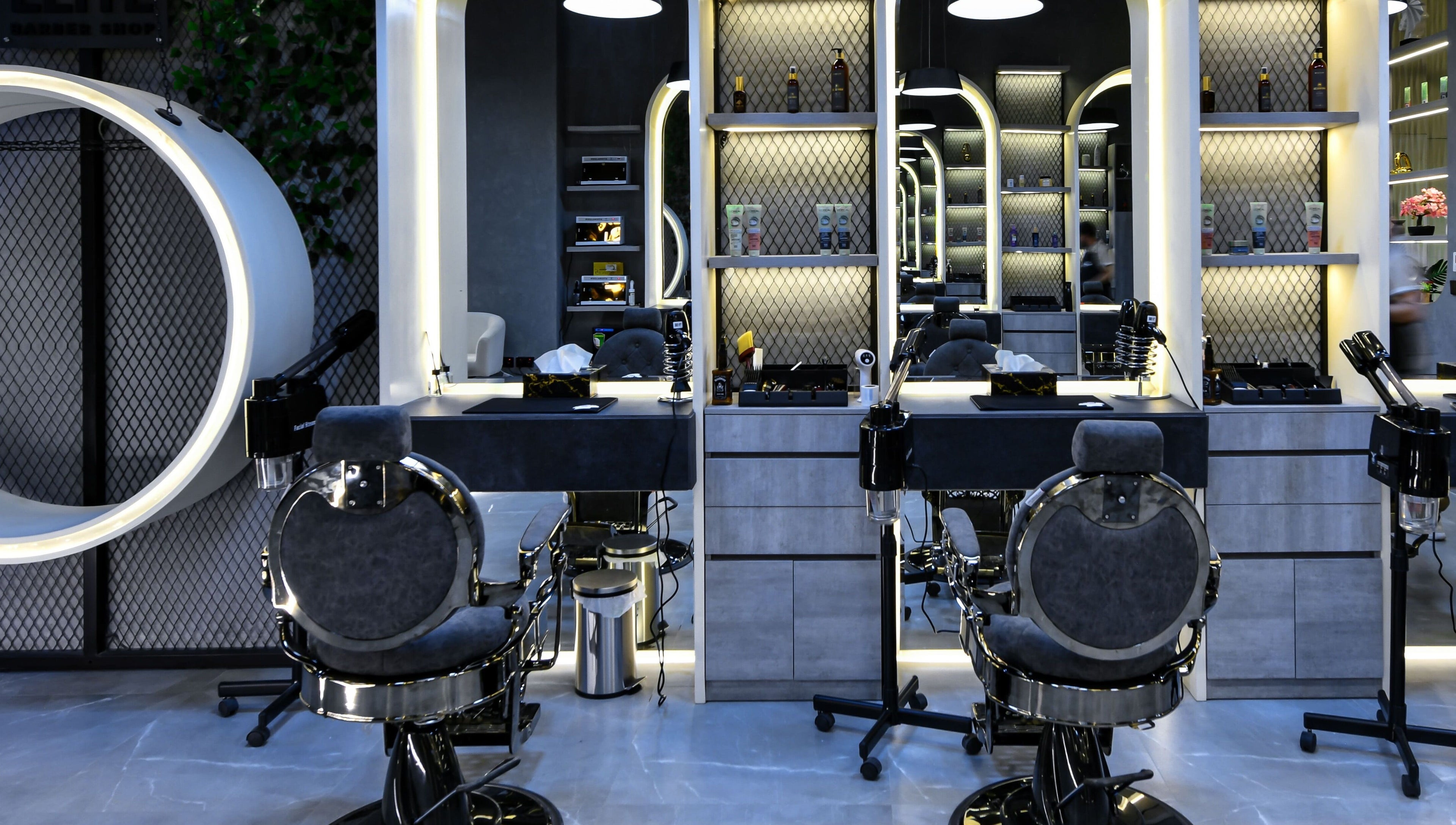 Modern interior of L8 Elite Barbershop in Riyadh, Riyadh Province, SA, featuring stylish barber chairs and equipment.