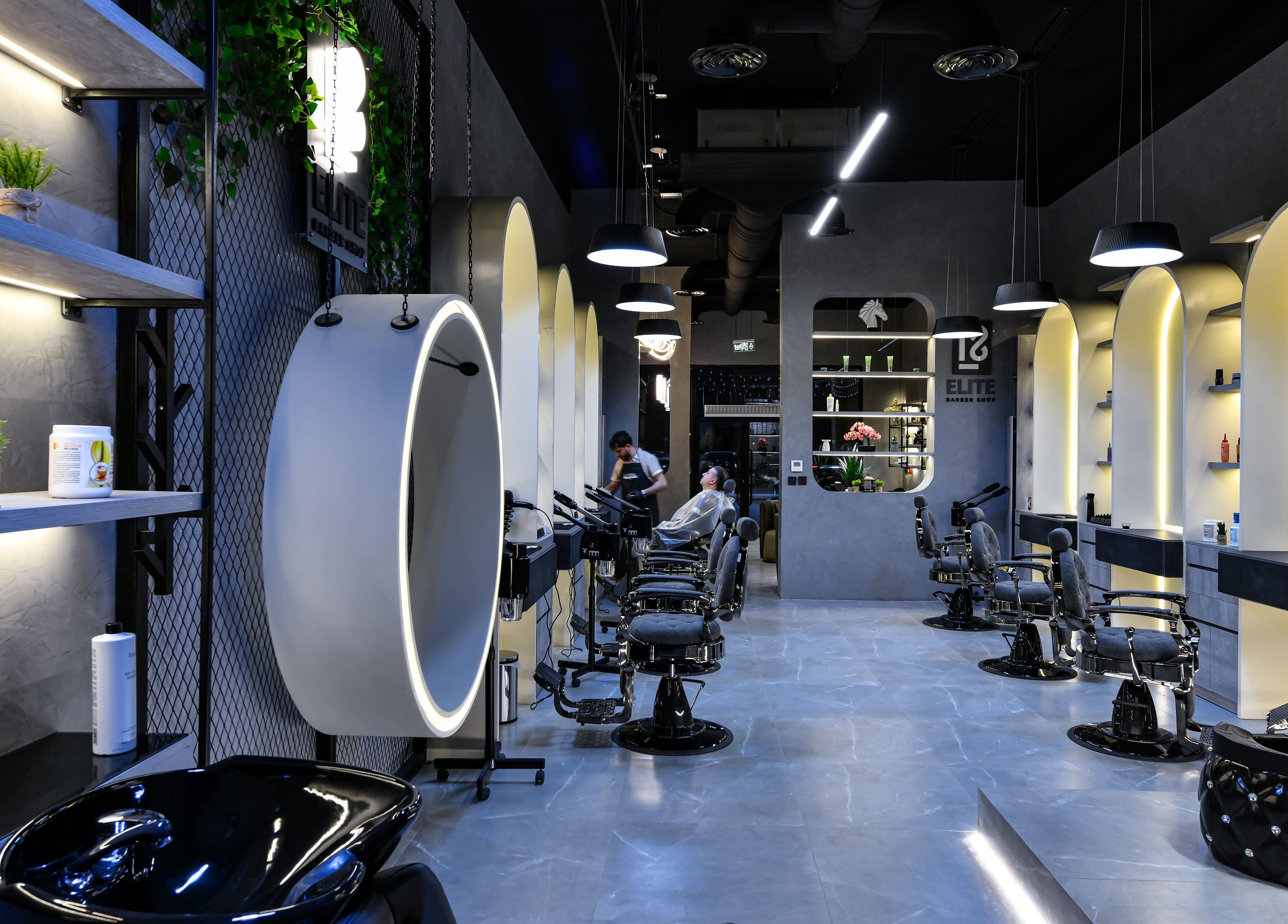 Modern interior of L8 Elite Barbershop in Riyadh, Riyadh Province, SA with sleek design and barber chairs.