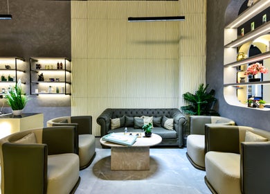 Spacious lounge at L8 Elite Barbershop, Riyadh, features elegant seating and decor for a relaxing experience.