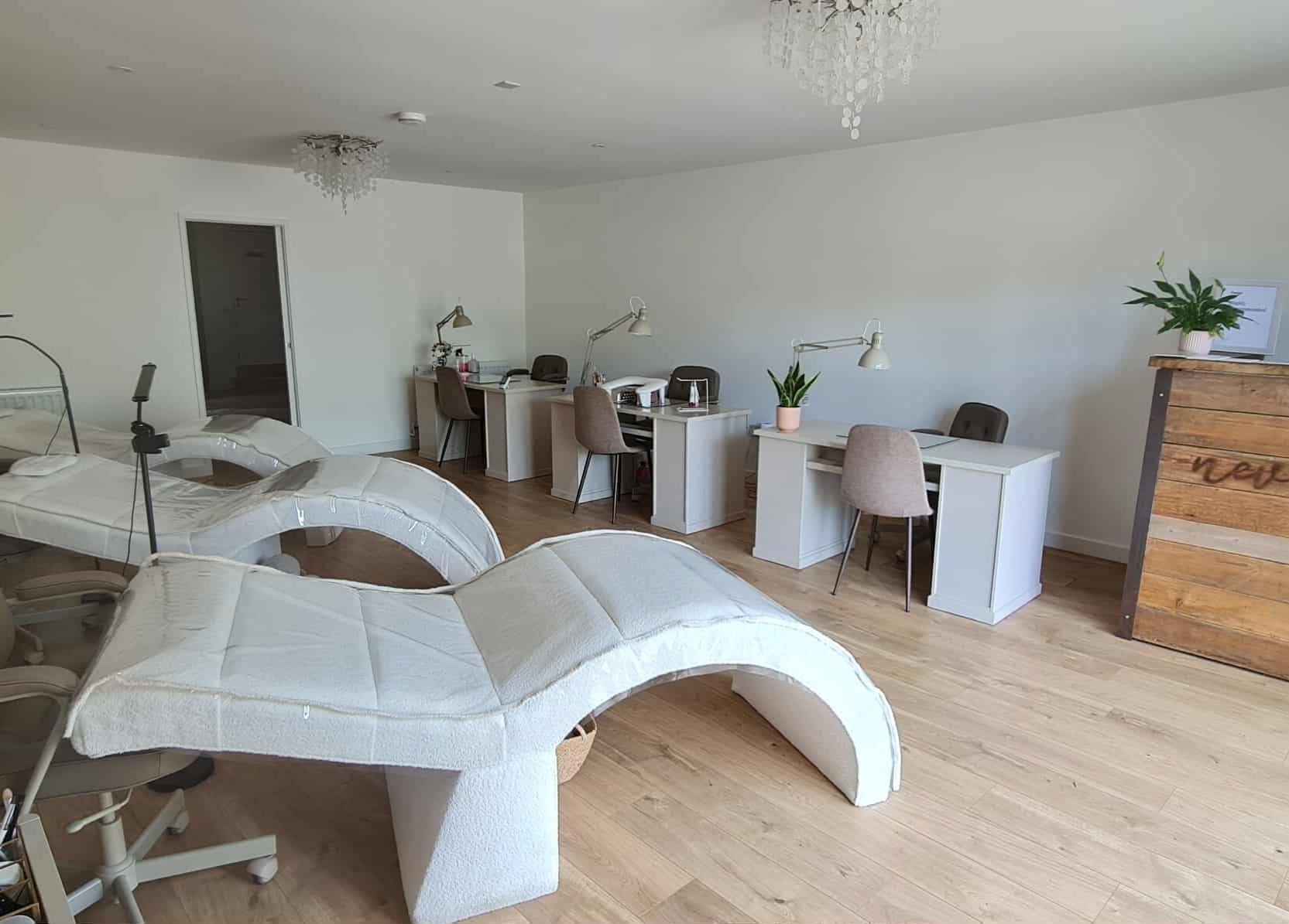 Modern lash and brow studio at RG Lash and Brow Artistry in Par, England, GB with cozy chairs and workstations.