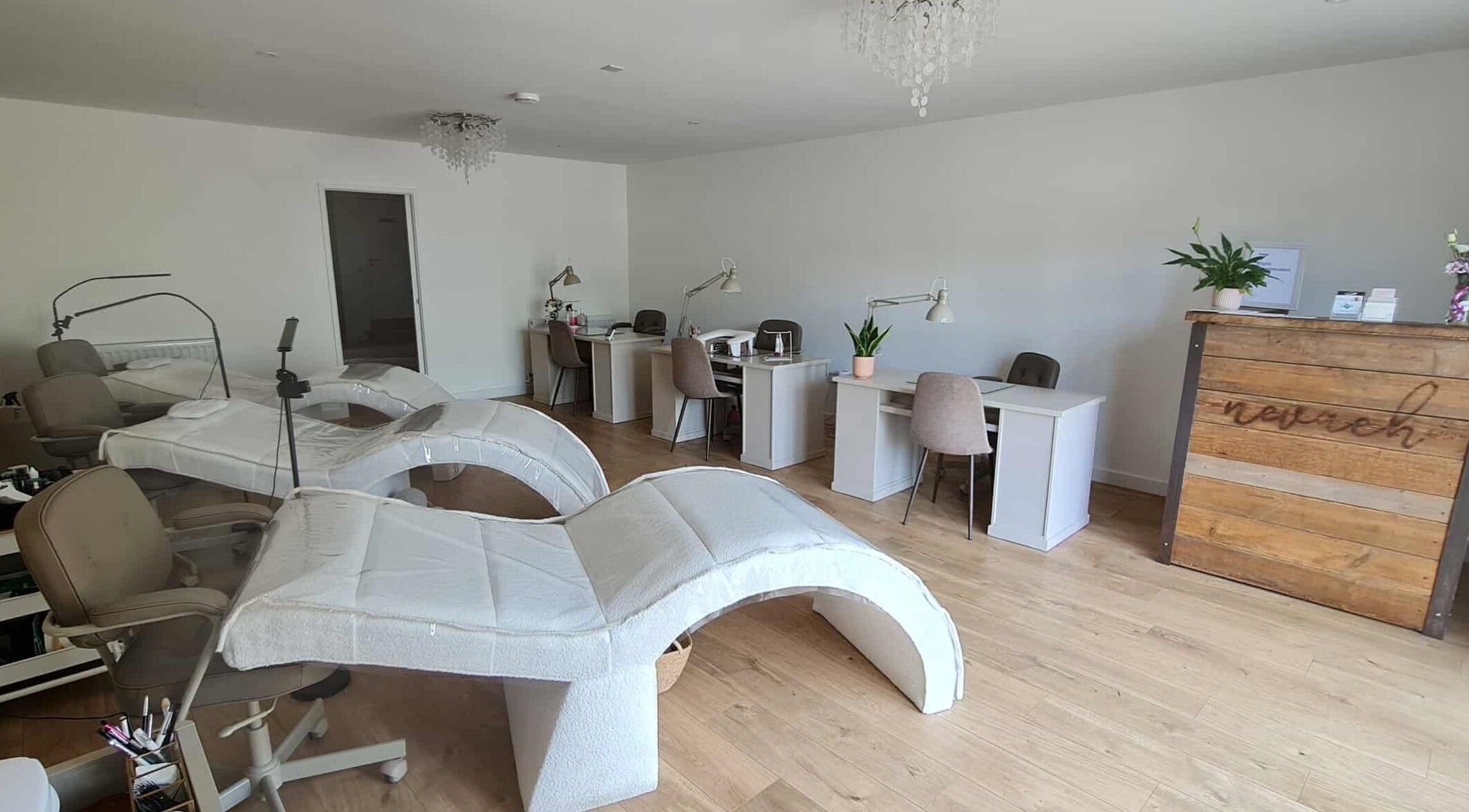 Modern lash and brow studio at RG Lash and Brow Artistry in Par, England, GB with cozy chairs and workstations.
