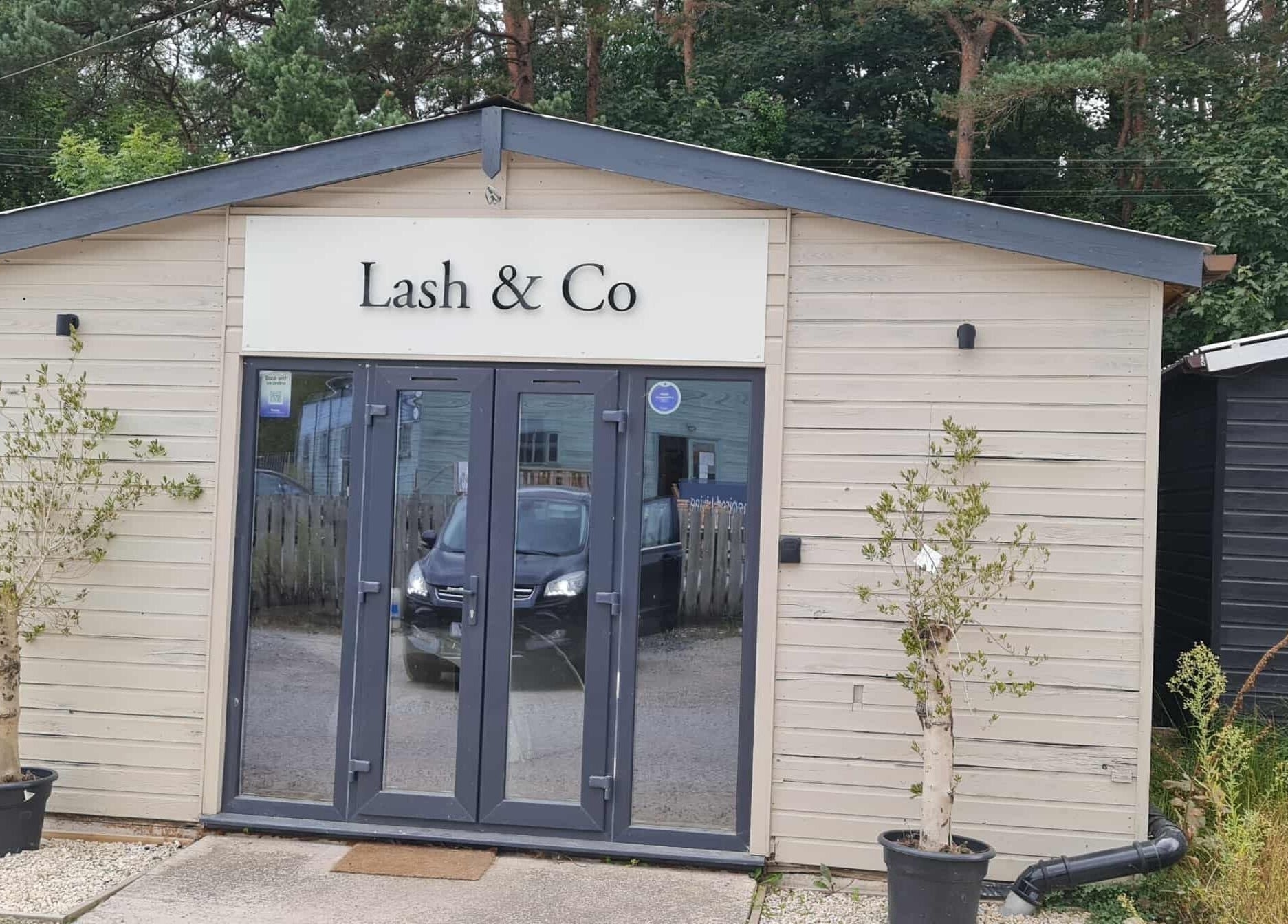 Front view of RG Lash and Brow Artistry in Par, England, GB featuring modern exterior and glass doors.