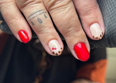 Stylish manicure with cherry and leopard designs at Nails by CG in Invergordon, Scotland, GB.