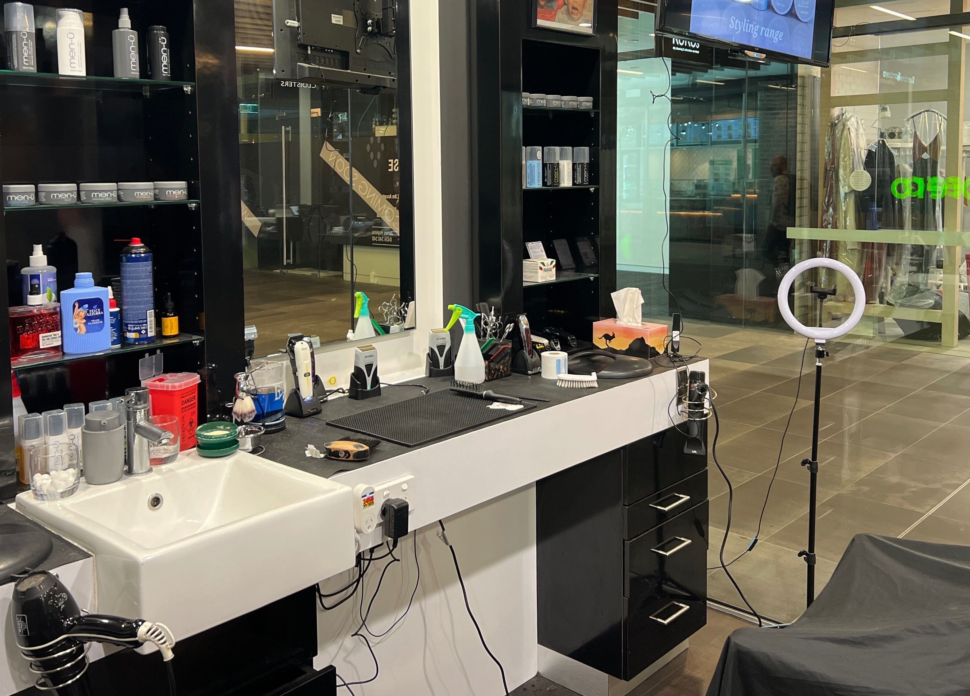 Cloisters - Hirani Barbers in Perth, Australia, showcases a well-stocked grooming station and modern barber chair.