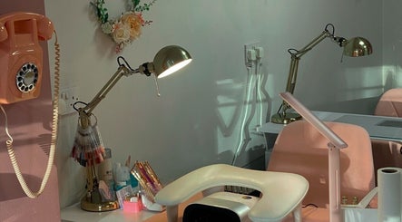 Cozy nail station at ONYX Nails & Beauty, Worsley, England featuring retro phone and floral decor.