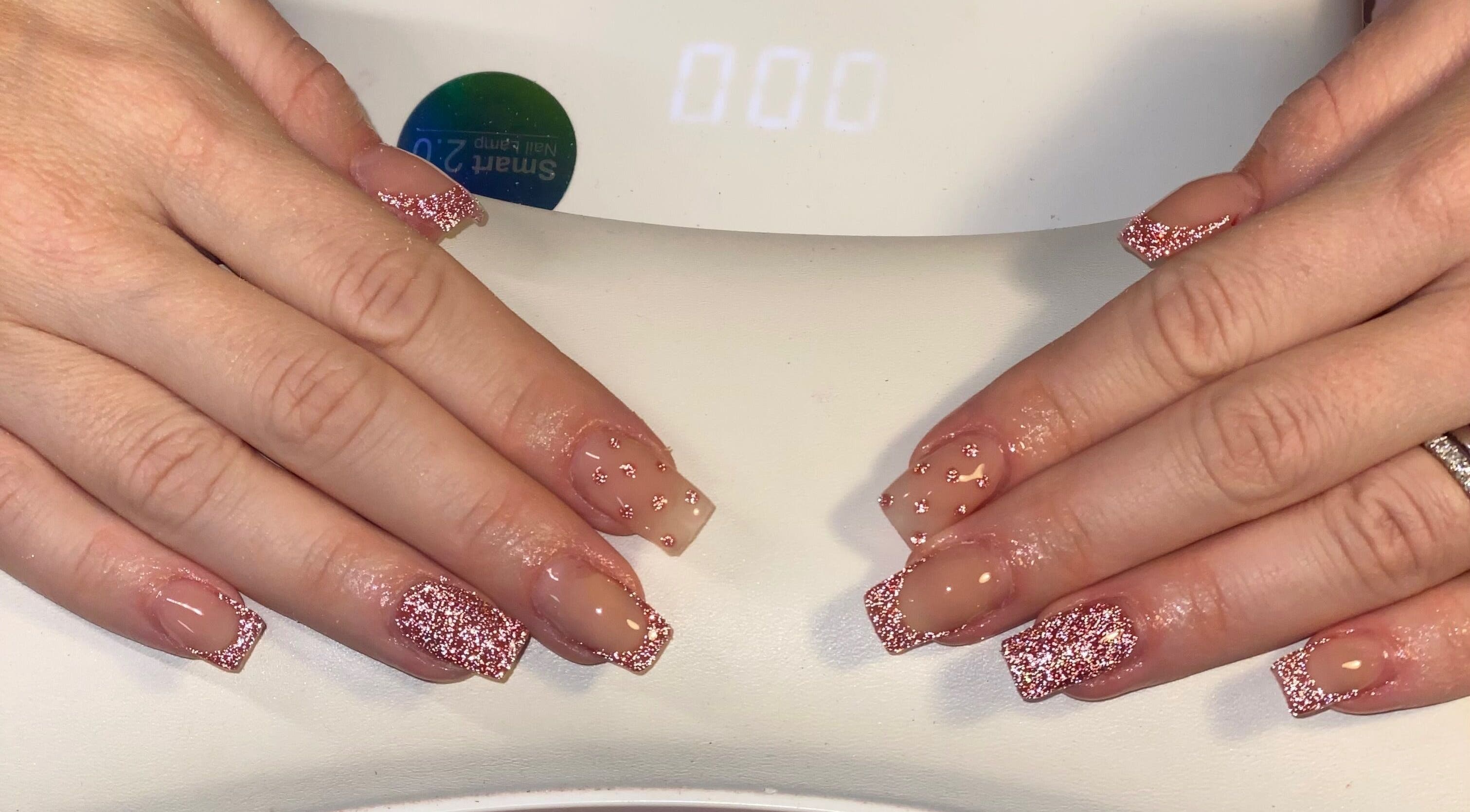 Glittery nude manicure at ONYX Nails & Beauty, Worsley, England, GB, showcasing delicate pink sparkle.