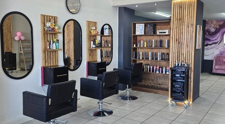 Interior of Belle Vee Hair and Beauty Studio in George, Western Cape, ZA with stylish salon chairs and mirrors.