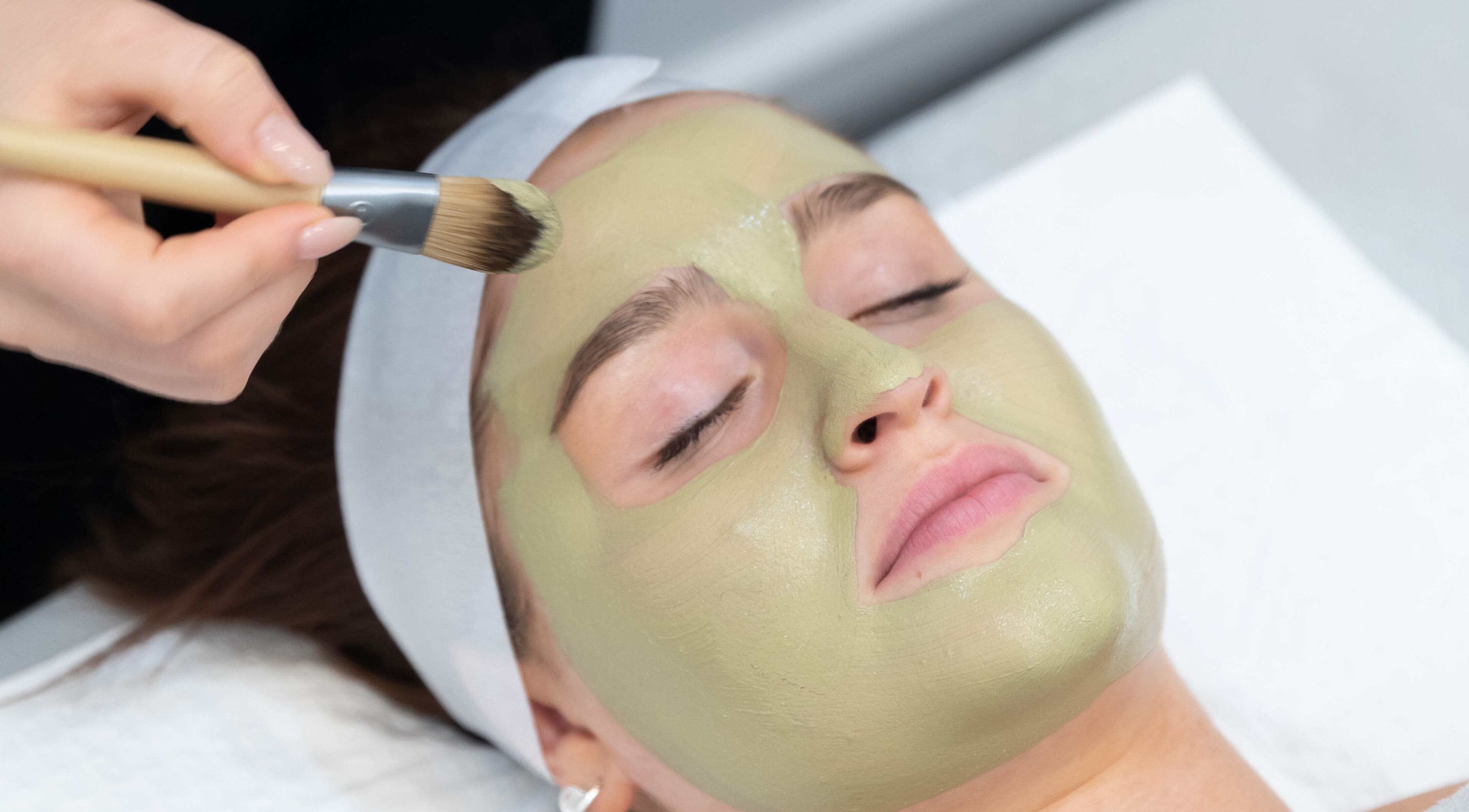 Spa client receives a soothing green clay facial at Adelaide Skin Therapy in Malvern, South Australia, AU.