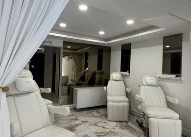 Elegant treatment room at Olive's Beauty & Tanning - Chislehurst, Chislehurst, England, GB with plush seating.