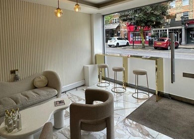 Chic interior at Olive's Beauty & Tanning - Chislehurst in Chislehurst, England, GB with plush seating and stylish decor.
