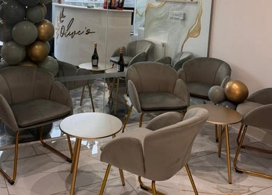 Sophisticated seating area at Olive's Beauty & Tanning - Beckenham with plush chairs and gold accents, Beckenham, England, GB.