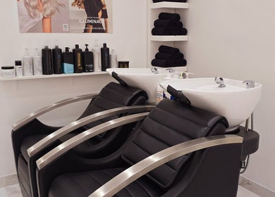 Modern hair wash stations at London City Hair Salon Limited, London, England, GB, showcasing sleek design.