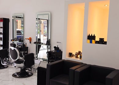 Modern interior of London City Hair Salon Limited in London, England, GB with stylish chairs and luxurious decor.