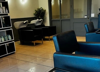 Interior of Studio 94 Hairdressing in Westport, County Mayo, IE with sleek chairs and modern decor.