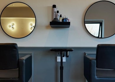 Elegant styling area with black chairs and mirrors at Studio 94 Hairdressing, Westport, County Mayo, IE.