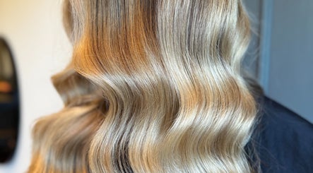 Blonde wavy hair styled at Studio 94 Hairdressing, Westport, County Mayo, IE, showcasing vibrant color and shine.