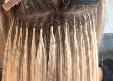 Hair extensions in progress at Studio 94 Hairdressing, Westport, County Mayo, IE, showcasing detailed craftsmanship.