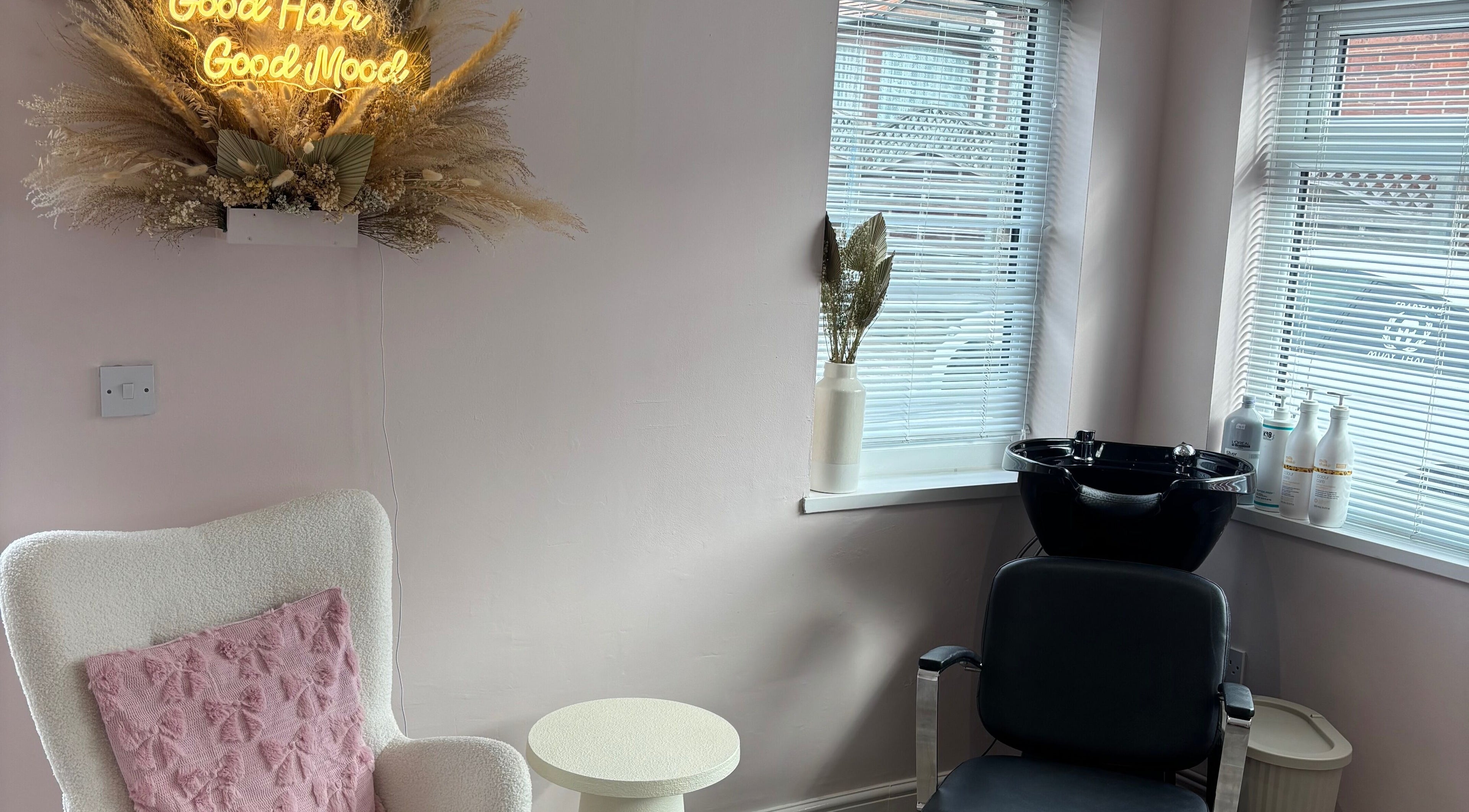 Inviting salon corner at Hair by Hannah, Hinckley, England, GB with plush chair and wash station.