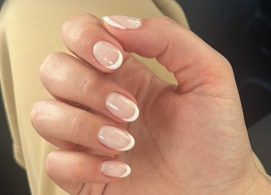 Beautiful French manicure at Pinky Bar in Bristol, England, GB showcases elegant nail art design.