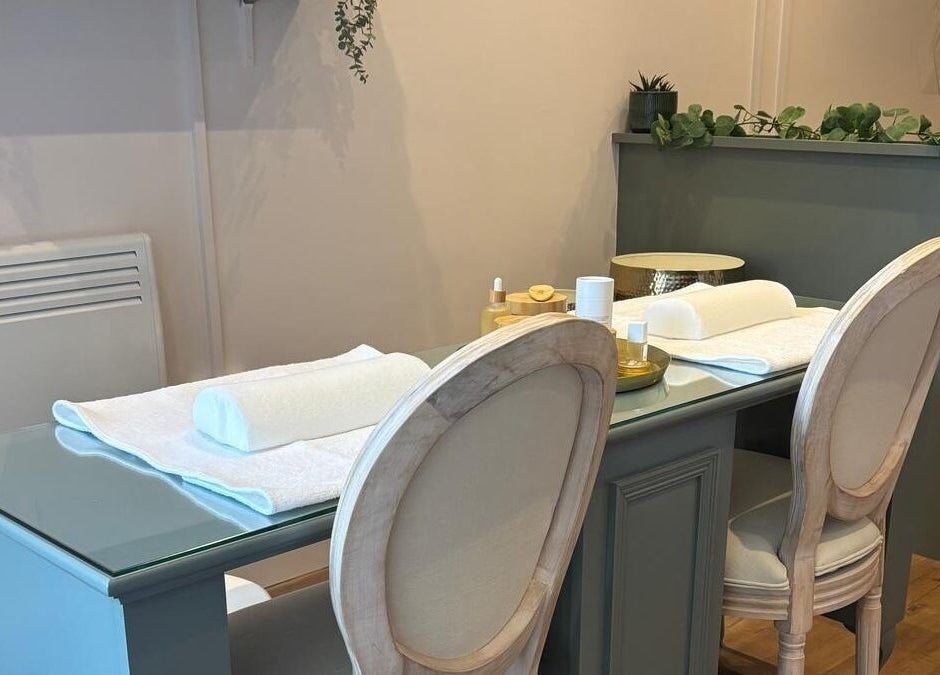 Elegant nail care setup at Belle, Otley, England, GB. Features comfortable seating and modern decor.