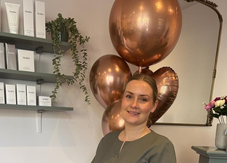 Inside Belle in Otley, England, showcasing beauty products, balloons, and welcoming atmosphere.