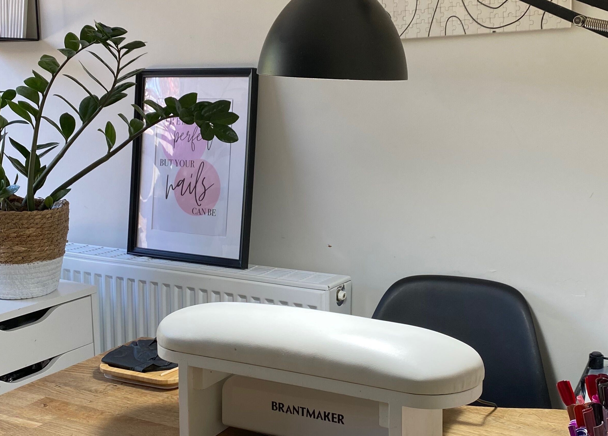 Milanailed_it nail studio in Bristol, England, GB with a stylish setup, plants, and nail care tools.