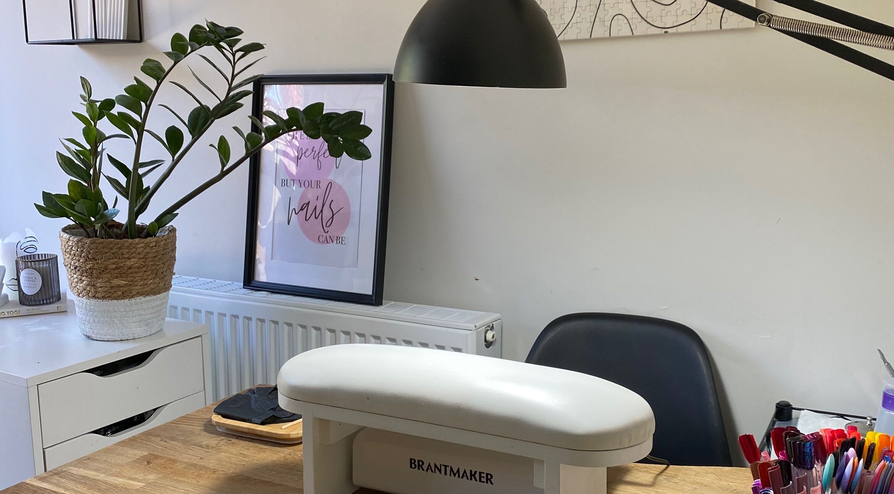 Milanailed_it nail studio in Bristol, England, GB with a stylish setup, plants, and nail care tools.