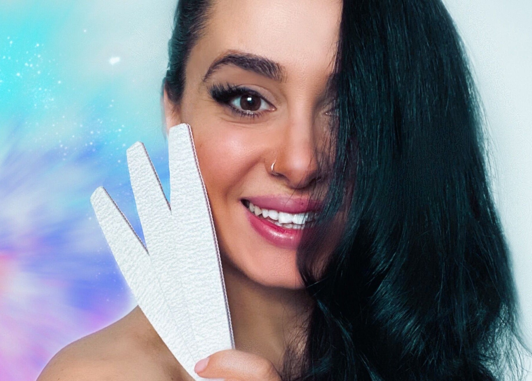 Smiling individual at Milanailed_it in Bristol, England, GB, holding a nail file with a vibrant backdrop.