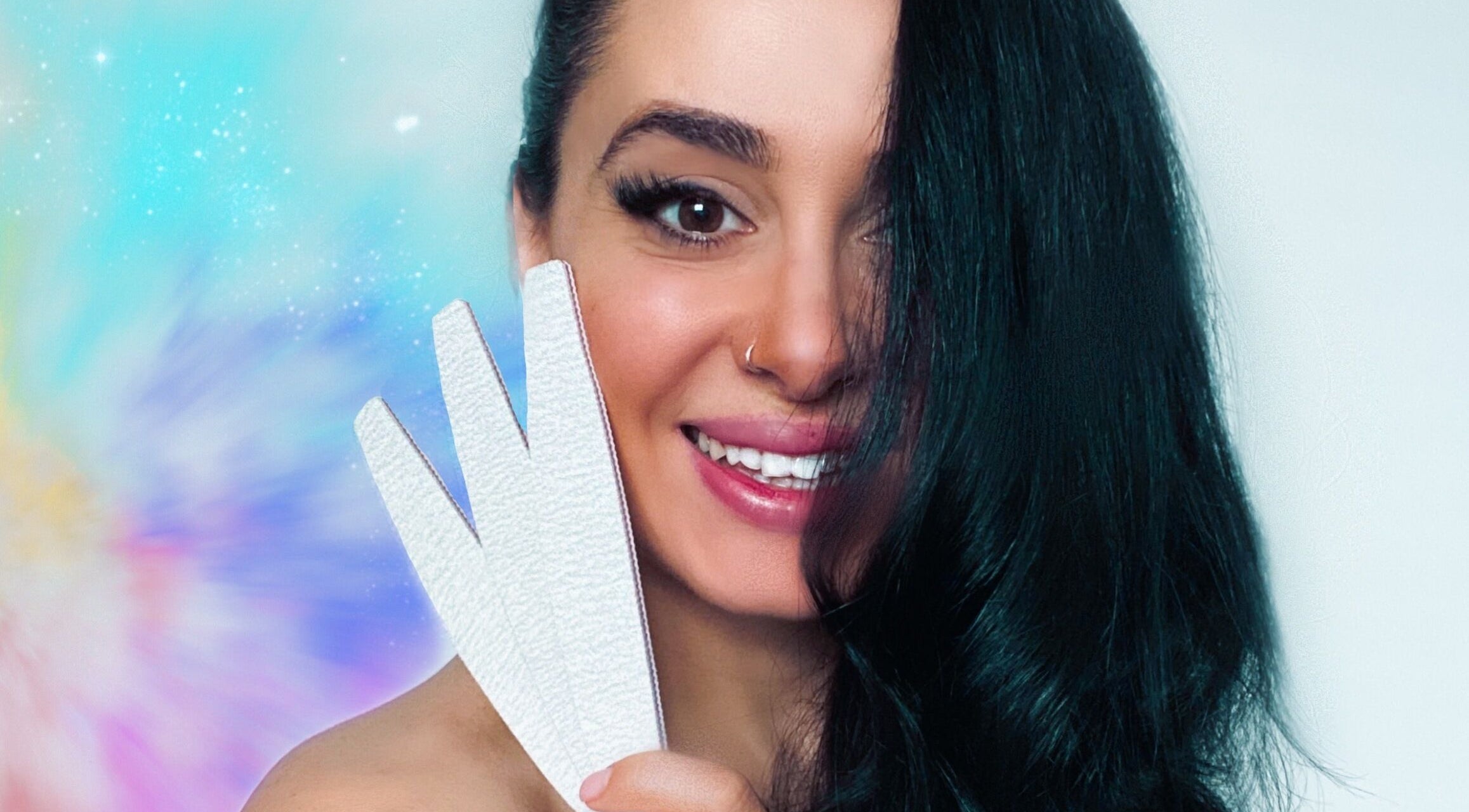 Smiling individual at Milanailed_it in Bristol, England, GB, holding a nail file with a vibrant backdrop.