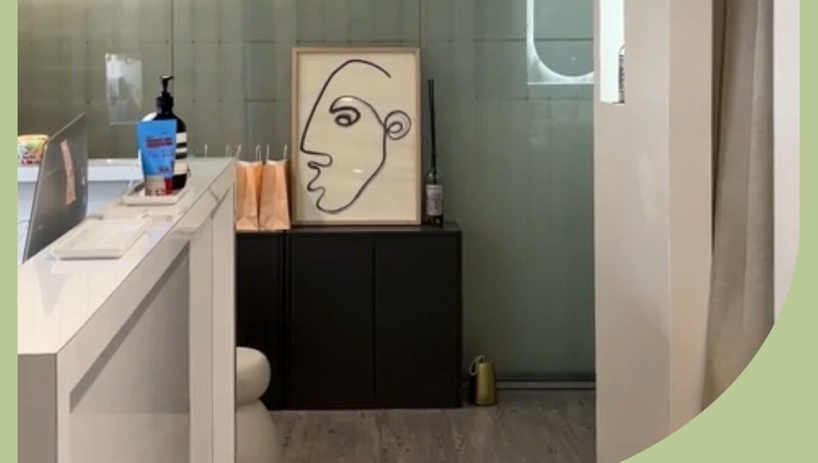 Inner Beauty Sydney's chic lobby in Chatswood, New South Wales, AU, featuring modern art and sleek decor.