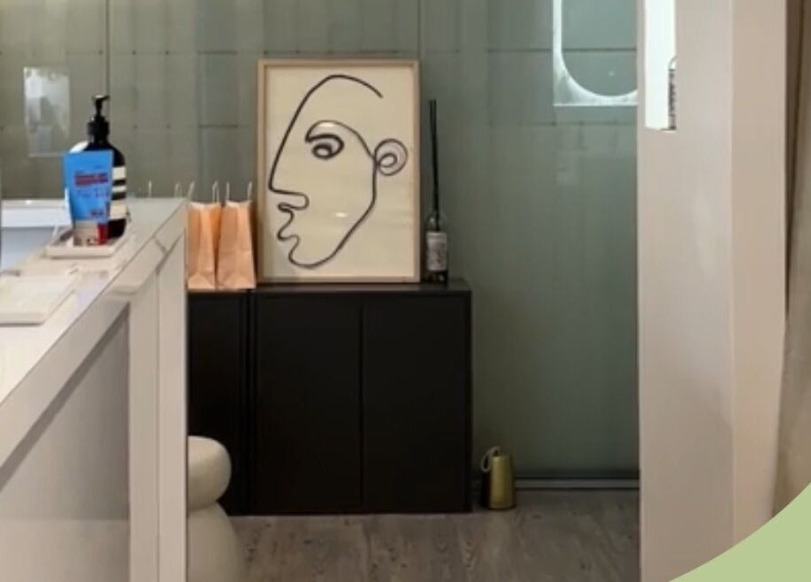 Inner Beauty Sydney's chic lobby in Chatswood, New South Wales, AU, featuring modern art and sleek decor.